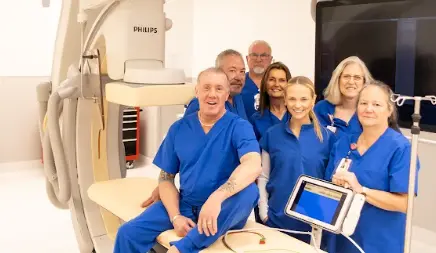 Dr. Jeffrey Tauth and his care team in a cardiac catheterization lab